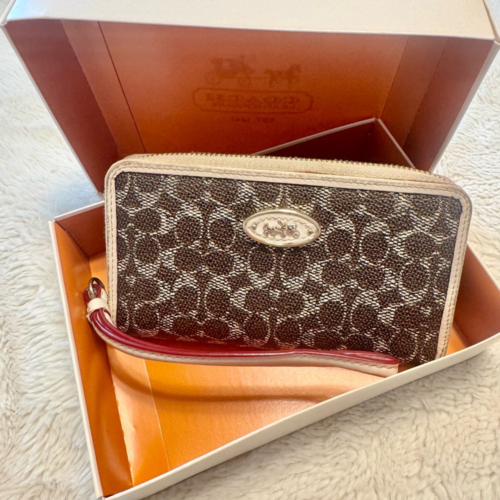 Coach signature Brown and Cream Wristlet. Comes with Coach box.